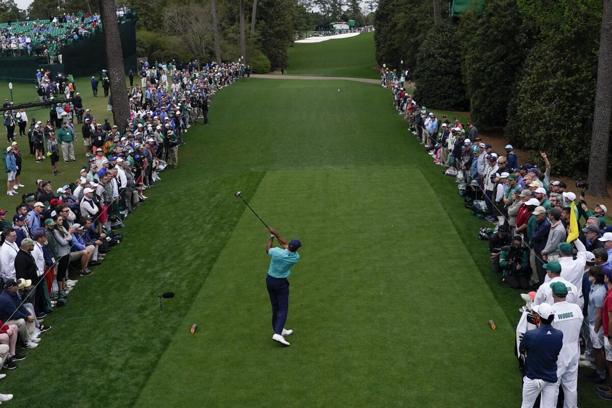 Tiger Woods tees off on the 18th hole during the second round at the Masters on Friday.