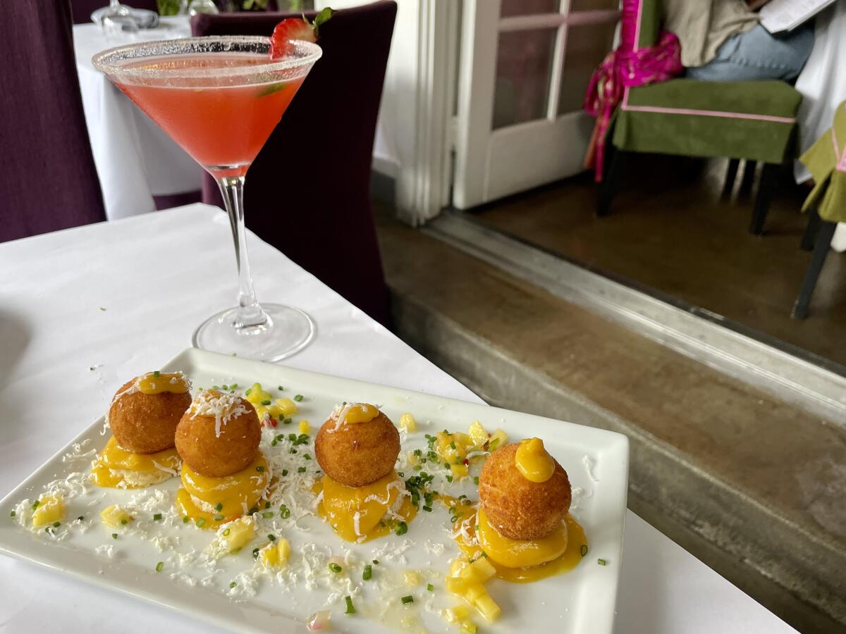 A Gitana martini and an order of fried goat cheese balls at Sur Restaurant and Lounge.