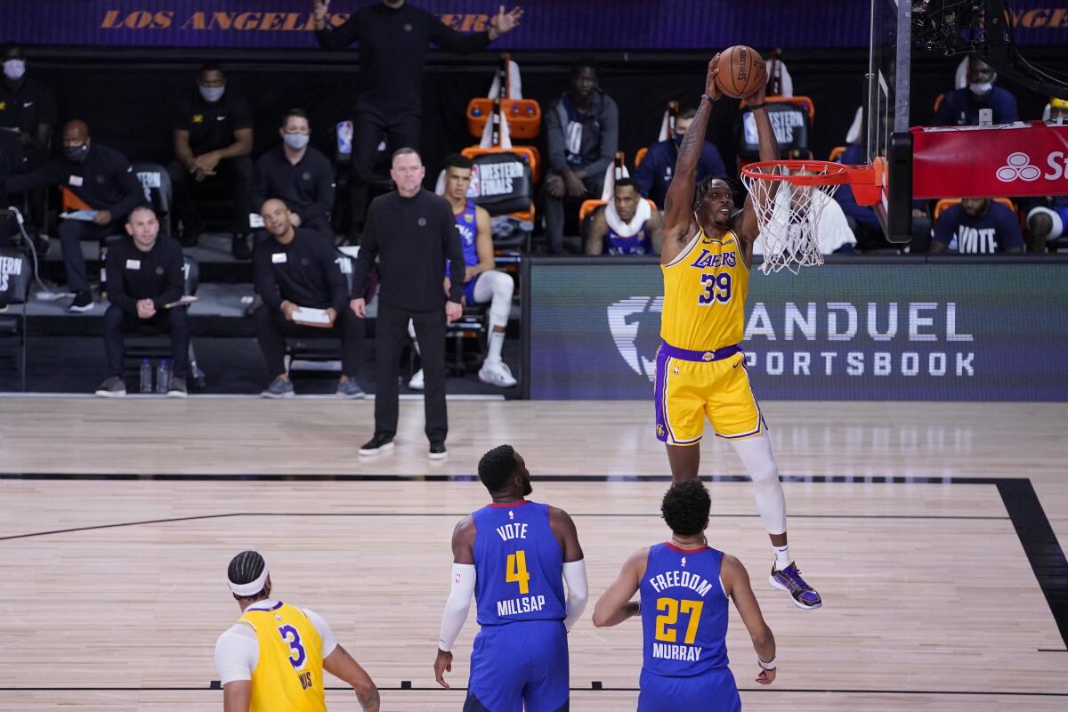 Lakers center Dwight Howard prepares to dunk after receiving an alley-oop pass during Game 1 on Sept. 18, 2020.