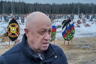 FILE - Wagner Group head Yevgeny Prigozhin attends the funeral of Dmitry Menshikov, a fighter of the Wagner group who died during a special operation in Ukraine, at the Beloostrovskoye cemetery outside St. Petersburg, Russia, on Dec. 24, 2022. Prigozhin's criticism of the top military brass is in stark contrast with more than two decades of rigidly controlled rule by President Vladimir Putin without any sign of infighting among his top lieutenants. (AP Photo, File)