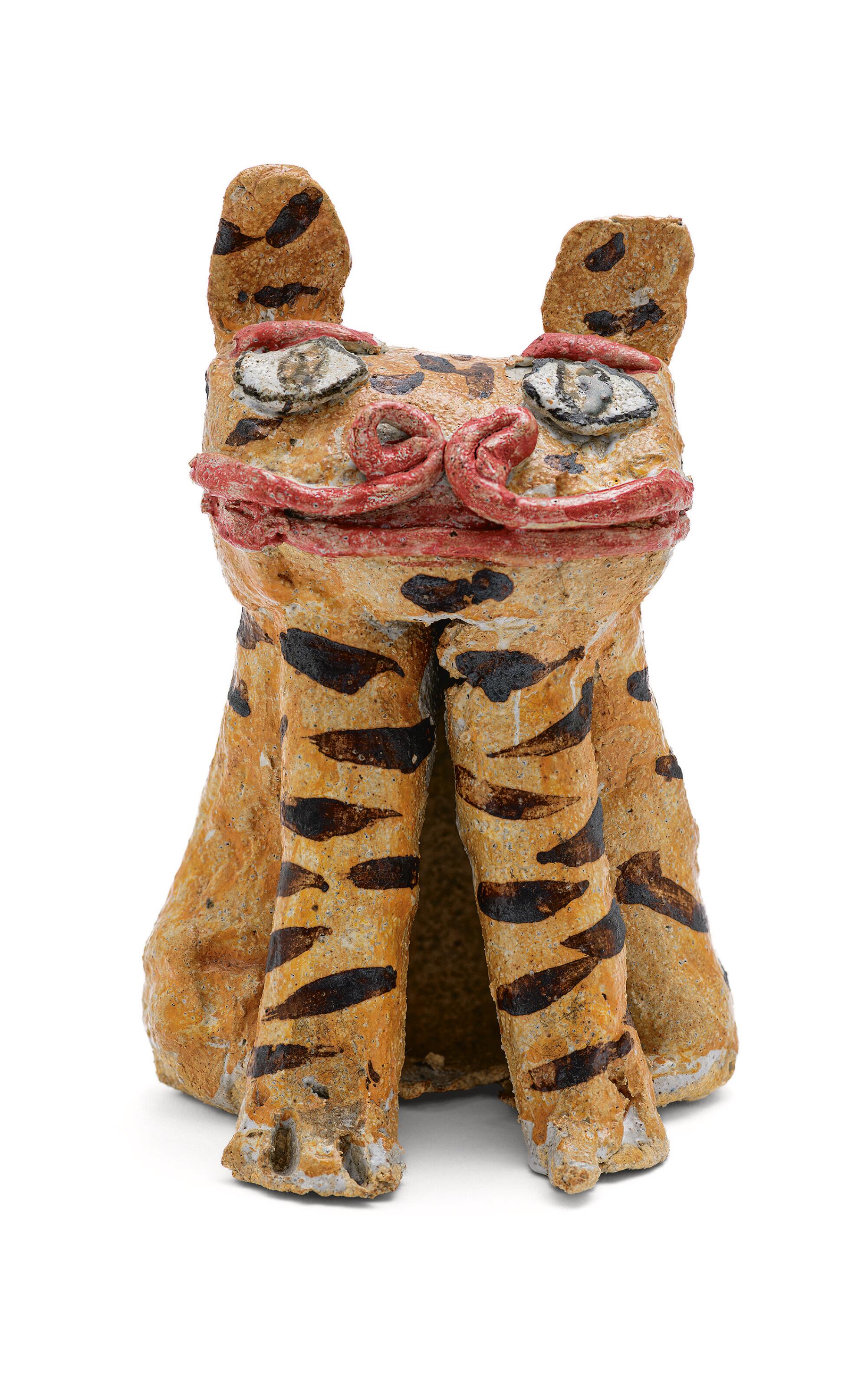 An untitled sculpture of a creature with a slight smile, its orange body adorned with black stripes. 