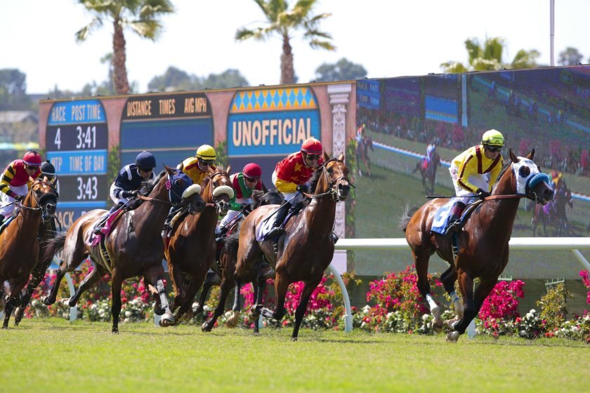 Fitch Ratings lowered its debt rating for $39.9 million in Del Mar Race Track Authority bonds over declining attendance at tracks statewide, which might be worsened by continued social distancing measures this year.