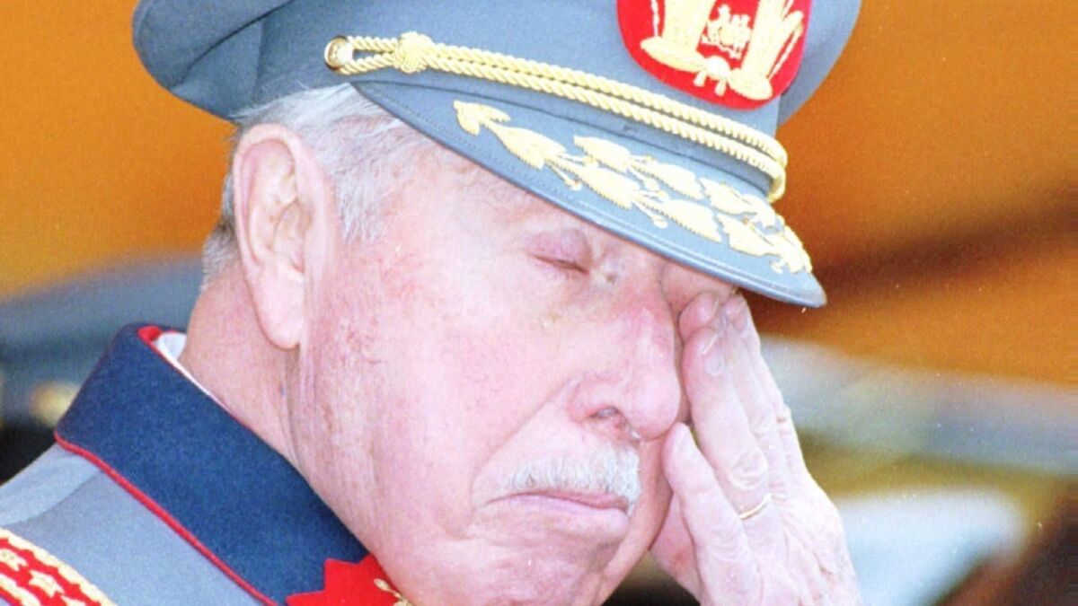 Former Chilean dictator Gen. Augusto Pinochet, in a 1996 photo, at a ceremony marking the 10th anniversary of an attempt on his life in which five of his bodyguards were killed.