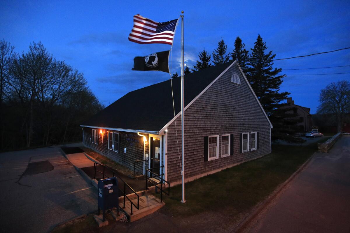 New American flag flies outside post office on Deer Isle, Maine