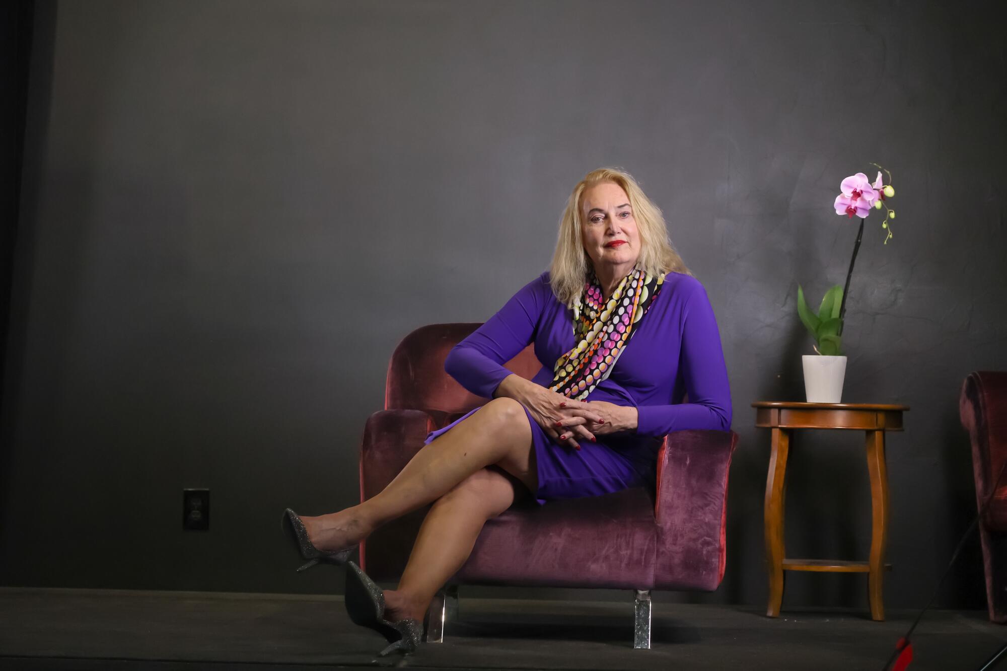 Erica Anderson, a transgender clinical psychologist, sits in a chair.