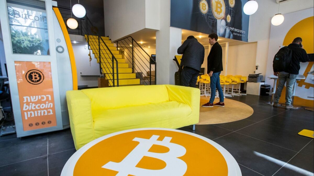 Israelis buy Bitcoins at the cryptocurrency "Bitcoin Change" shop in Tel Aviv. Recently, the price of the electronic currency has stabilized.