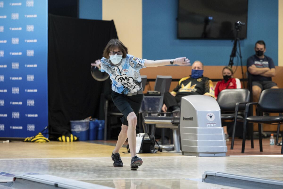 Critical care nurse and professional bowler Erin McCarthy competes at the 2021 PWBA Kickoff Classic Series in Arlington, Texas, Jan. 26, 2021. "You have to have a calm demeanor and think clearly," McCarthy says. "I think that's probably why I love doing them both equally as much." (USBC via AP)