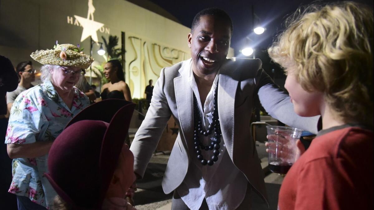 Leslie Odom Jr., who won a Tony for the role of Aaron Burr, greets guests at the entrance plaza of the Centro de Bellas Artes Luis A. Ferré before the premiere.
