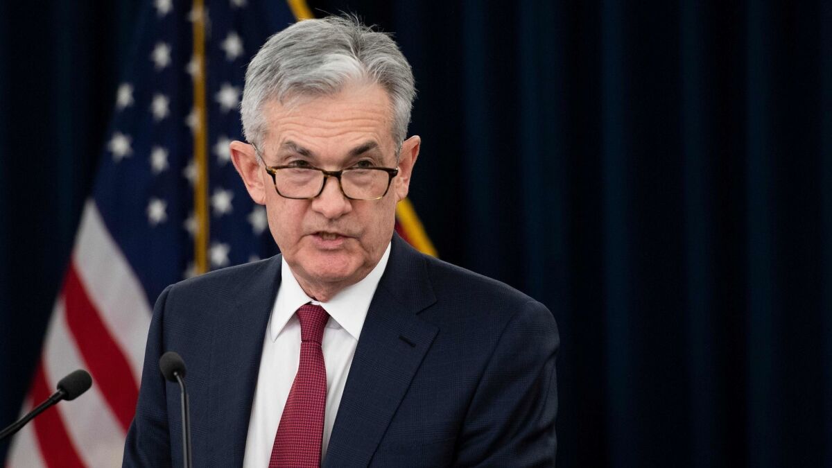 Federal Reserve Chairman Jerome H. Powell speaks to reporters in Washington on Dec. 19.