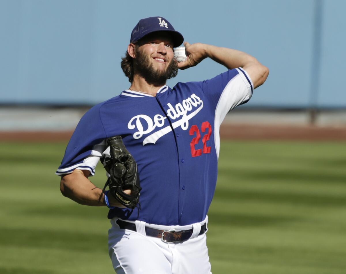 Dodgers starting pitcher Clayton Kershaw tosses before Game 2 of the NLDS against the Mets.