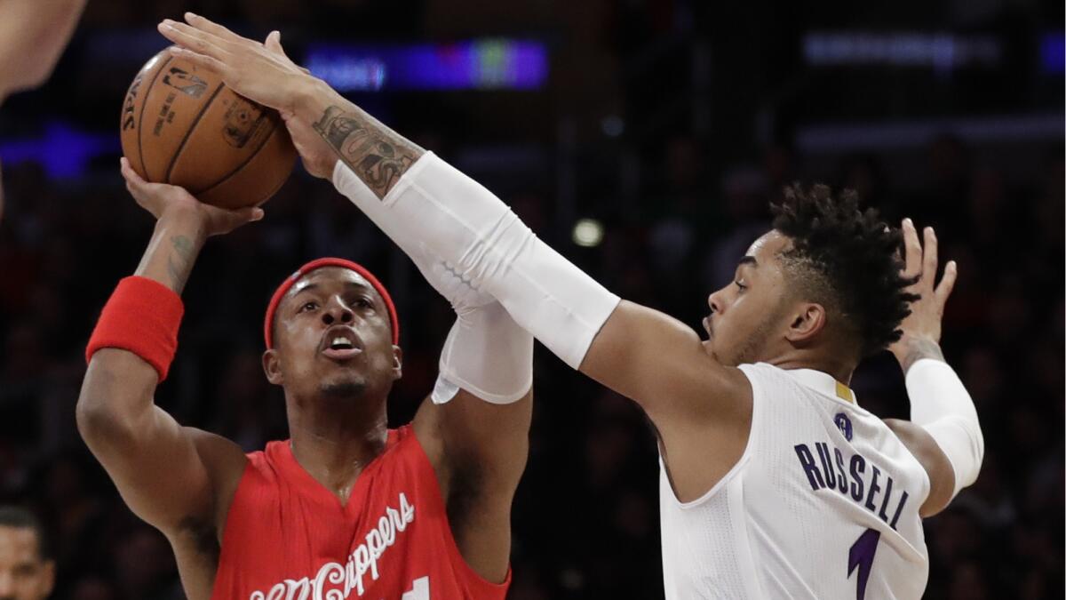 Clippers forward Paul Pierce shoots over Lakers guard D'Angelo Russell during the first half Sunday.