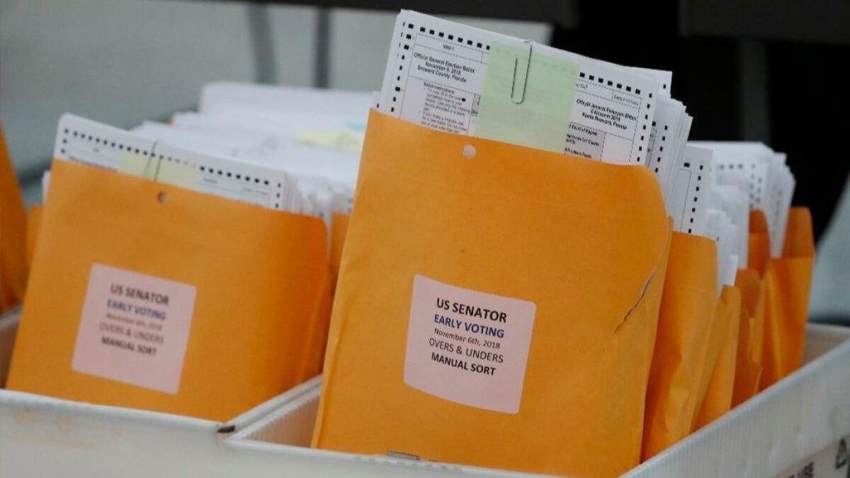 Boxes of ballots waiting to be examined at the Broward County Supervisor of Elections office on Nov. 16.