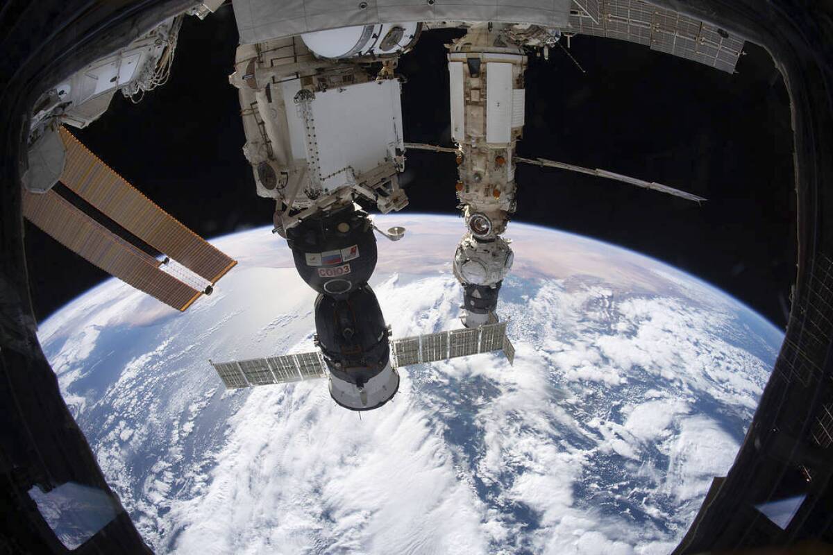This Dec. 6, 2021 photo provided by NASA shows the International Space Station orbited 264 miles above the Tyrrhenian Sea with the Soyuz MS-19 crew ship docked to the Rassvet module and the Prichal module, still attached to the Progress delivery craft, docked to the Nauka multipurpose module. The former head of the National Space Council tells The Associated Press, Wednesday, Feb. 23, 2022, that tensions in eastern Ukraine – and heightened Western fears of a Russian invasion – should not have a significant impact on the International Space Station or U.S.-Russia cooperation in space. (NASA via AP)
