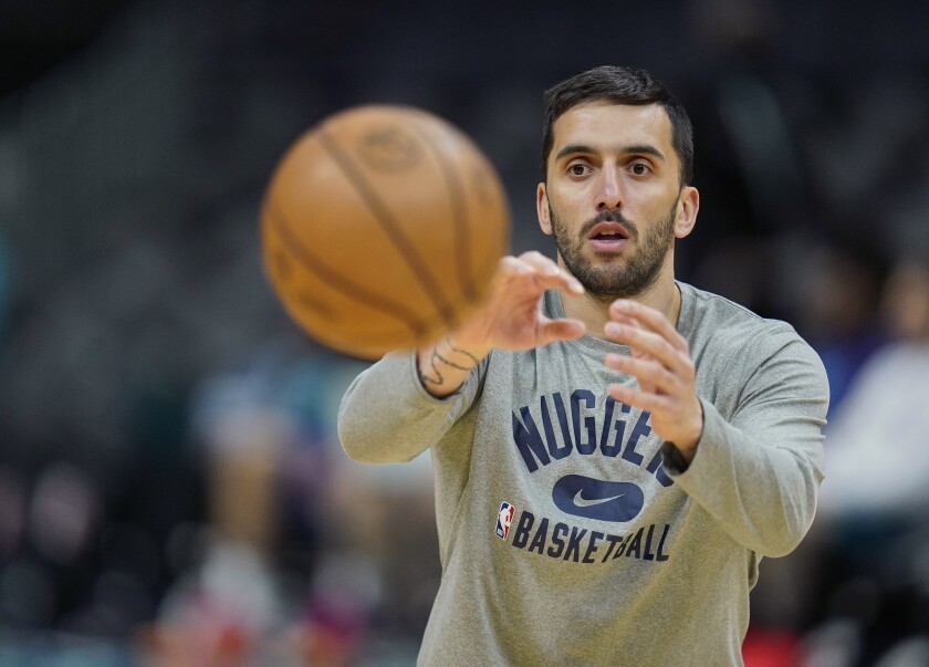 Denver Nuggets guard Facundo Campazzo warms up prior to an NBA basketball game against the Charlotte Hornets on Monday, March 28, 2022, in Charlotte, N.C. (AP Photo/Rusty Jones)