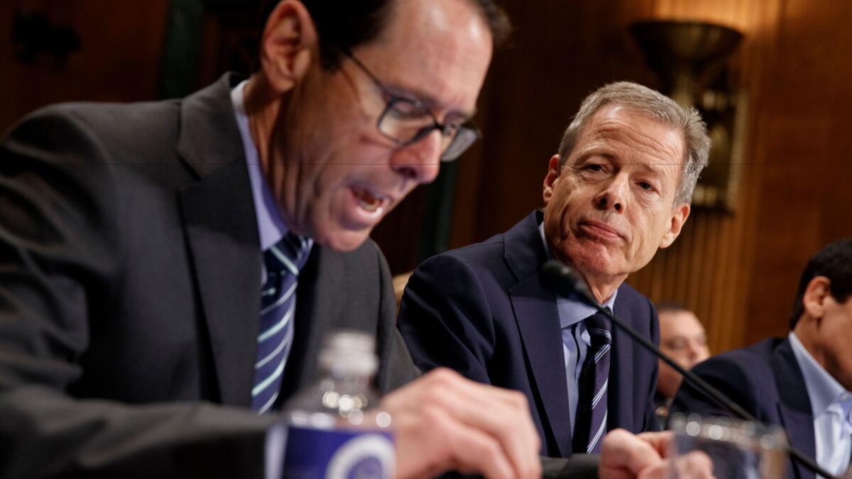 Time Warner Chairman and CEO Jeffrey Bewkes, right, listens as AT&T Chairman and CEO Randall Stephenson testifies on Capitol Hill in Washington in 2016.