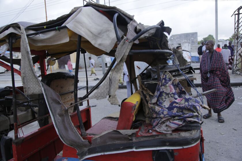 Destroyed tuktuk is seen outside the Pearl Beach hotel in Mogadishu, Somalia, Saturday, June. 10, 2023. Witnesses and state media in Somalia say extremists have attacked the beachside hotel in the capital, Mogadishu, and security forces are responding at the site as some people remain trapped inside.(AP Photo/Farah Abdi Warsameh)