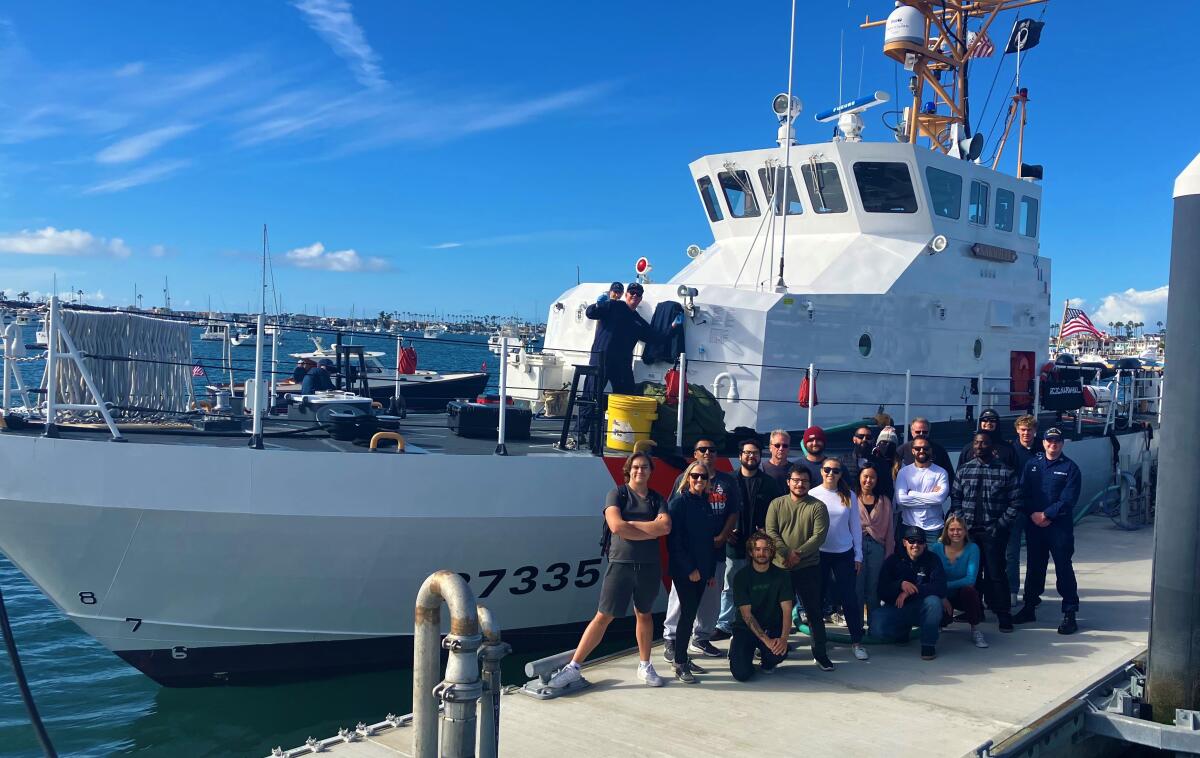 Students in Orange Coast College's Professional Maritime Program pose with a patrol boat.