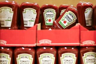 Bottles of The Kraft Heinz Co. ketchup in a supermarket.