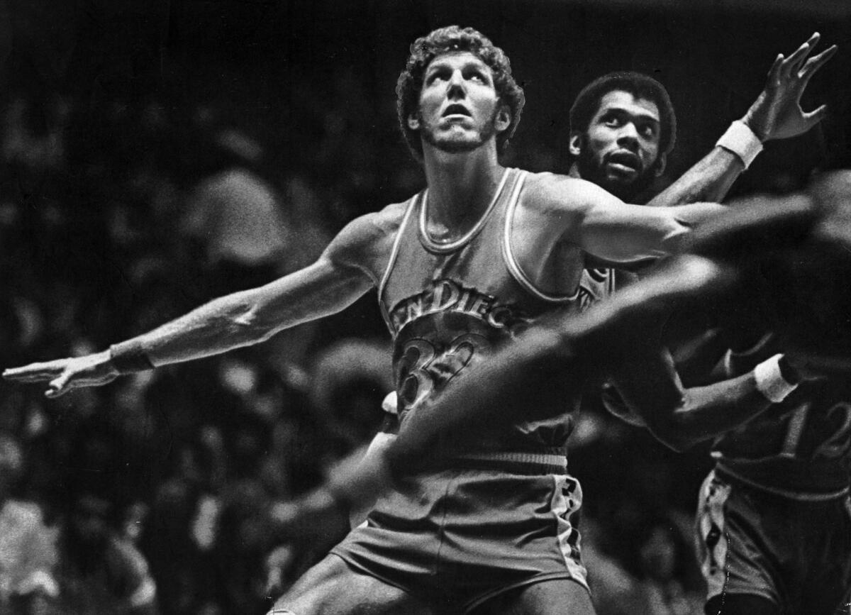 Sept. 27, 1979: San Diego Clipper Bill Walton spreads his arms to keep Kareem Abdul-Jabbar of the Lakers away from the ball during an exhibition game in Anaheim. This photo appeared in the Sept. 29, 1979, edition of The Times.