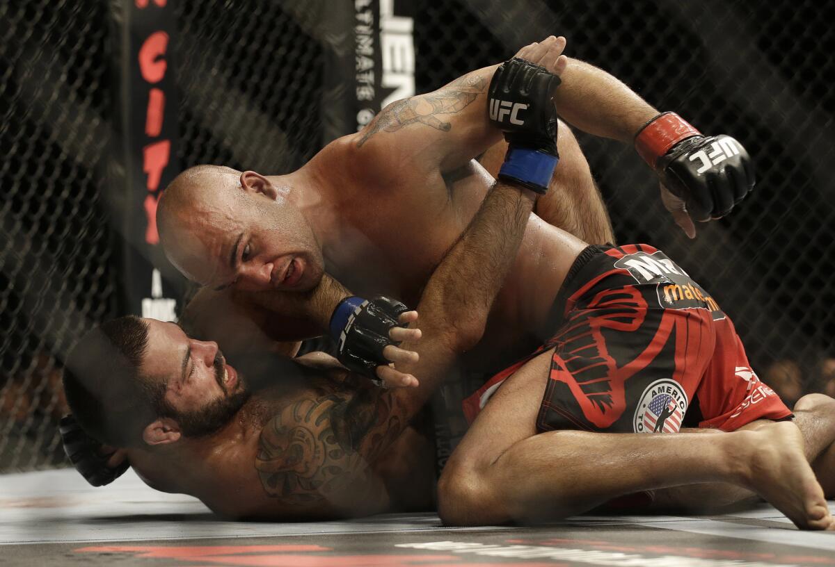 Robbie Lawler, top, grapples with Matt Brown during a welterweight mixed martial arts bout at a UFC on July 26. Lawler won by unanimous decision.