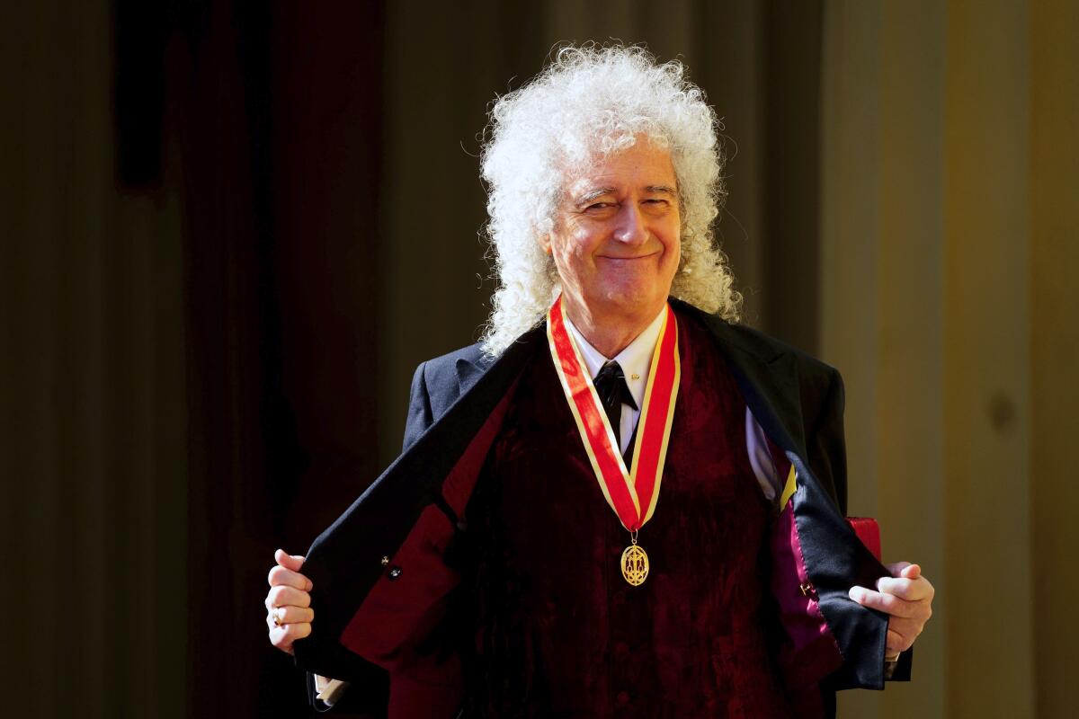 Queen rocker Brian May is dubbed a knight bachelor by king - Los Angeles Times