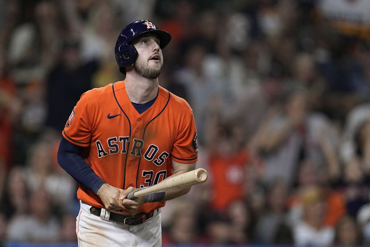 Houston Astros' Kyle Tucker watches his grand slam off Oakland Athletics relief pitcher Sam Moll during the fifth inning of a baseball game Friday, Aug. 12, 2022, in Houston. (AP Photo/Kevin M. Cox)