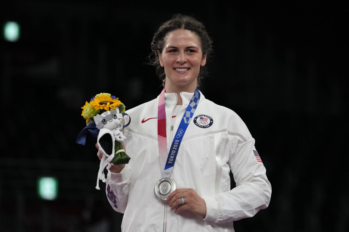 Silver medalist, United States Adeline Maria Gray celebrates during the ceremony medal for the women's 76kg freestyle wrestling at the 2020 Summer Olympics, Monday, Aug. 2, 2021, in Chiba, Japan. (AP Photo/Aaron Favila)