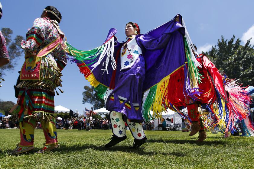 Esmeralda Hummingbird of San Diego dances during the Grand Entry at the 31st Annual Balboa Park Pow Wow at Balboa Park in San Diego on May 12, 2019. Esmerelda is a member of the Apache Nation.