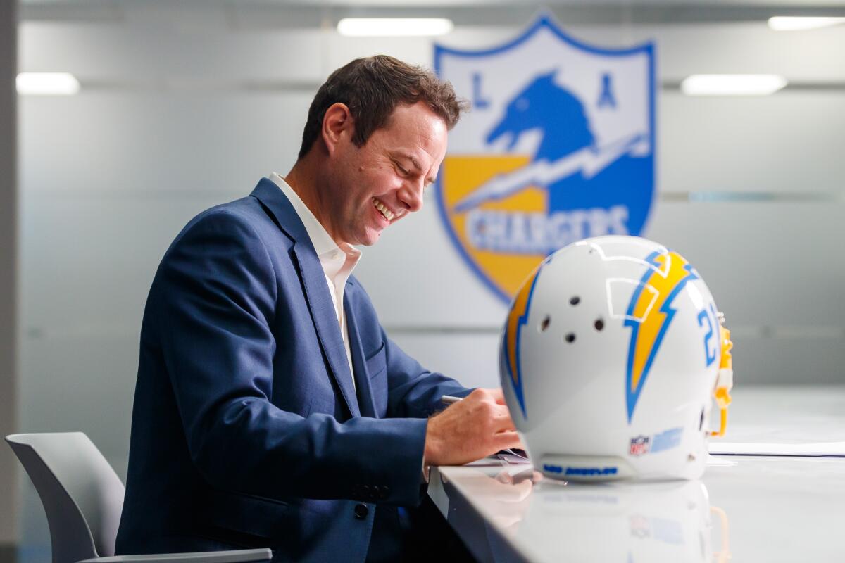 Brandon Staley smiles as he signs on to become the Chargers' 17th head coach.