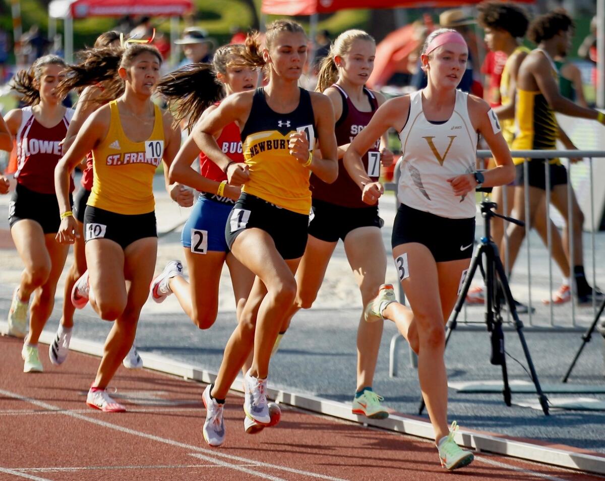 Sadie Englehardt of Ventura, right, and Sam McDonnell of Newbury Park were the top two finishers in a heat for 1,600 meters.