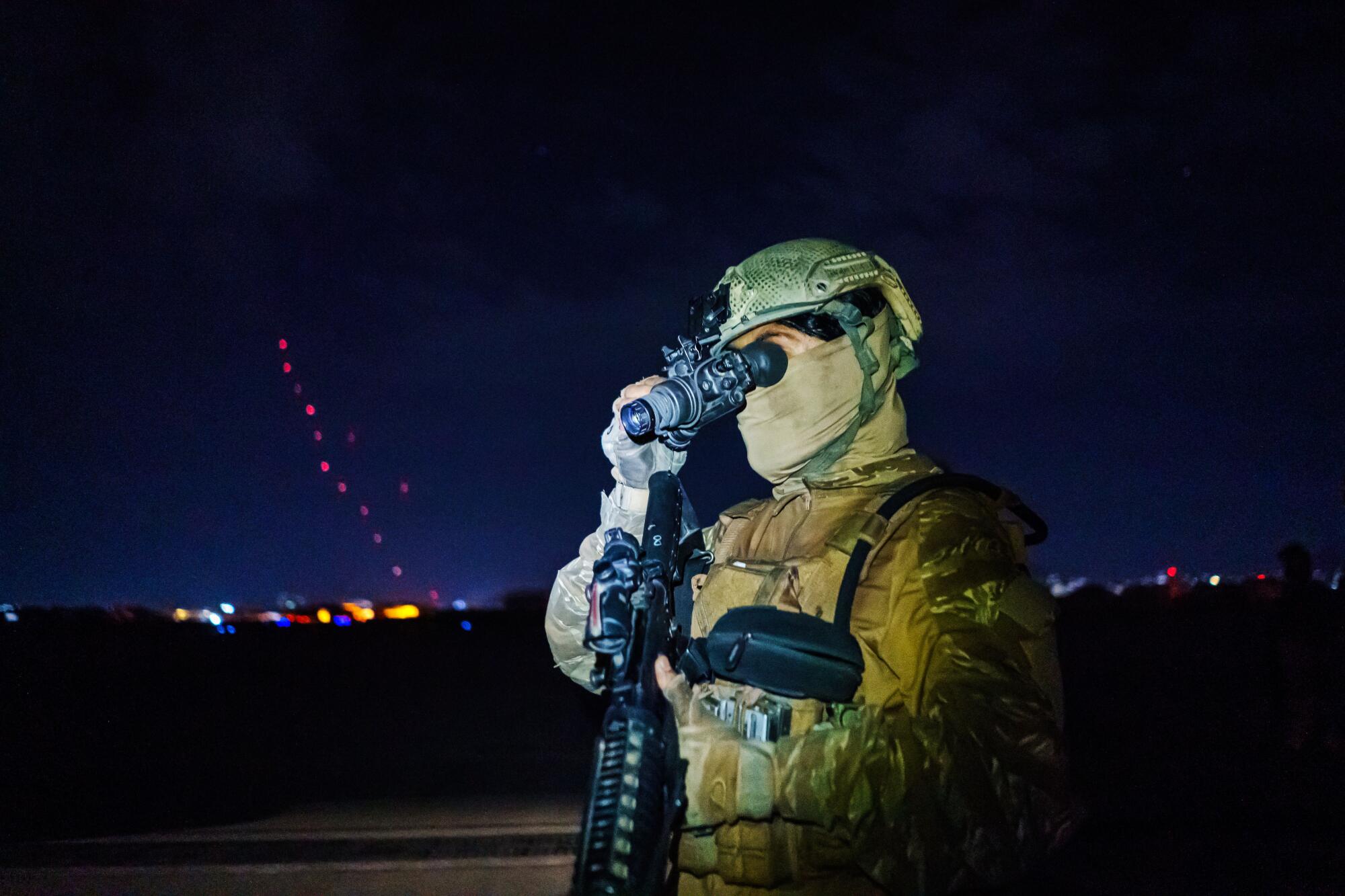 Taliban fighters from the Fateh Zwak unit, wielding American supplied weapons, equipment