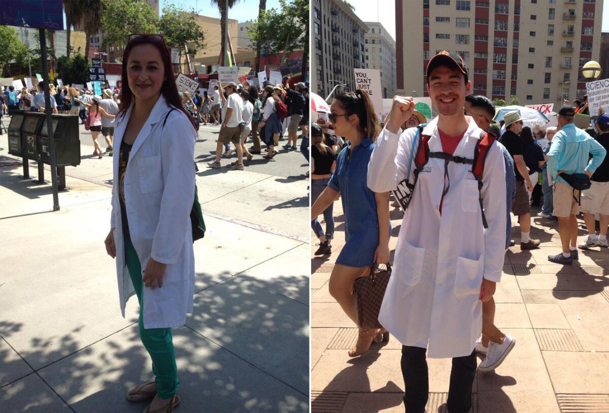 Kimberly Prado, left, and Morgan Hatch donned the lab coats they wear to work for the L.A. March for Science.