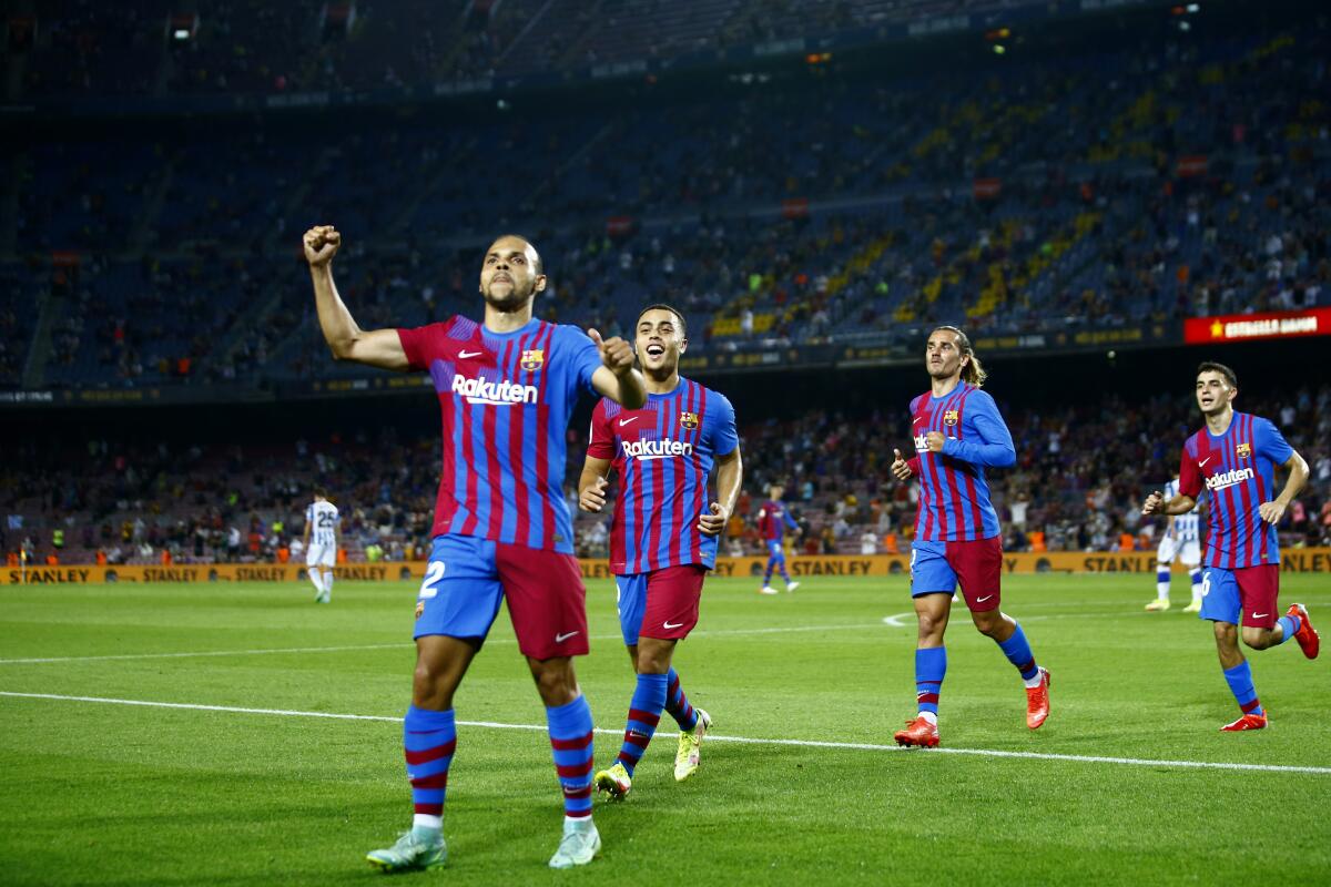 Barcelona's Martin Braithwaite, left, celebrates after scoring 