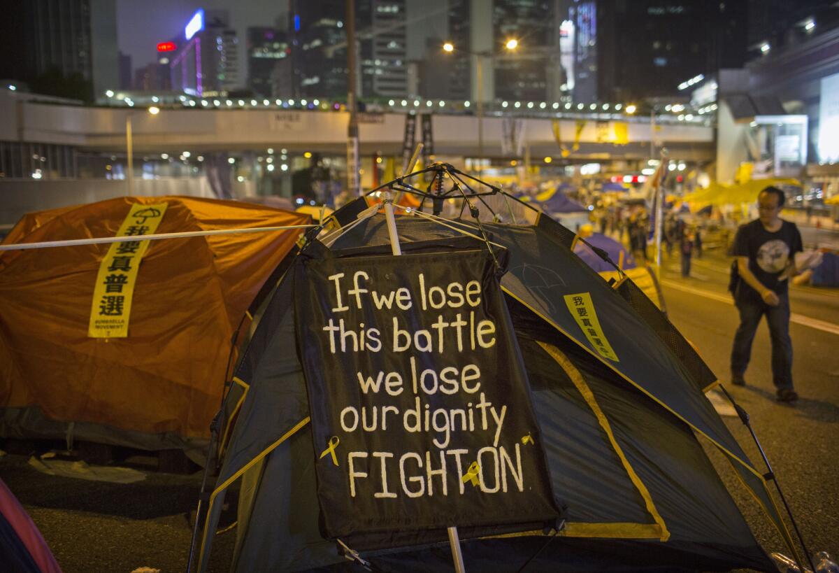 A protest sign is seen outside a tent at a pro-democracy demonstration site in the Admiralty district of Hong Kong on Nov. 12.