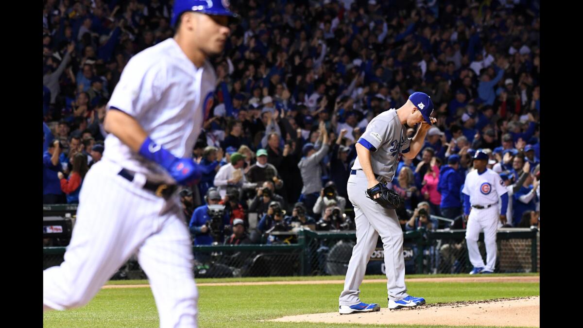 Dodgers pitcher Alex Wood gives up a solo home run to Cubs Wilson Contreras in the 2nd inning.