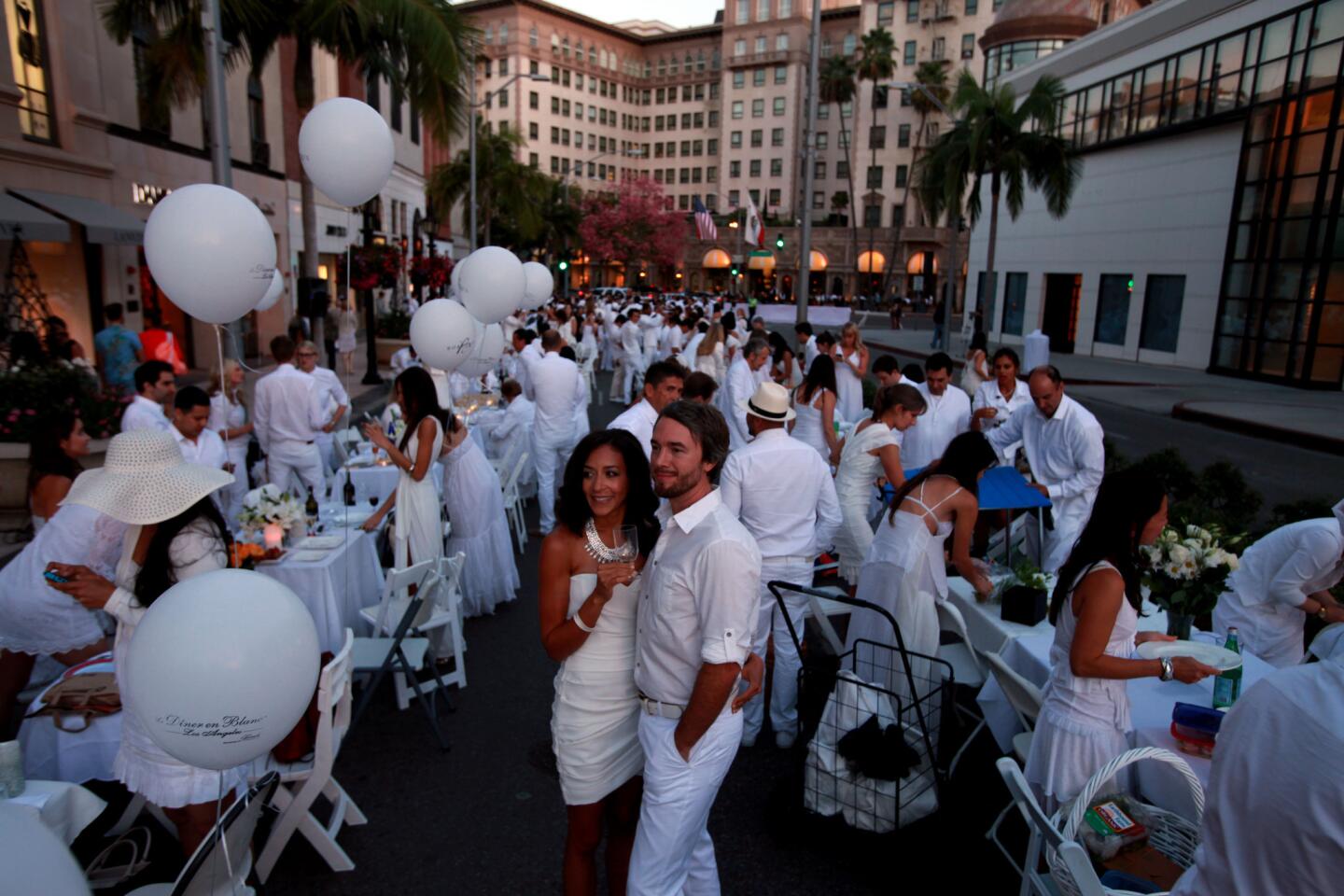 Beverly Hills was bathed in white as more than 1,200 people descended on Rodeo Drive with tables and chairs for a flash-mob dinner called Diner en Blanc.