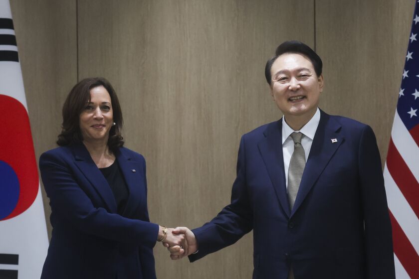 U.S. Vice President Kamala Harris, left, and South Korea's President Yoon Suk Yeol pose for a photo as they hold a bilateral meeting in Seoul Thursday, Sept. 29, 2022. (Leah Millis/Pool Photo via AP)