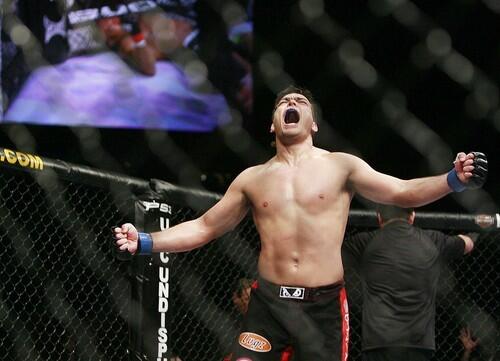 Lyoto Machida celebrates after knocking out Rashad Evans in the second round of their UFC light-heavyweight title bout in 2009.