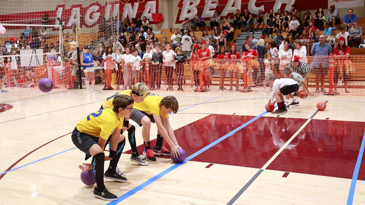 Teams begin action during the 8th annual SchoolPower Dodgeball tournament in the Laguna Beach High School gym on Wednesday.