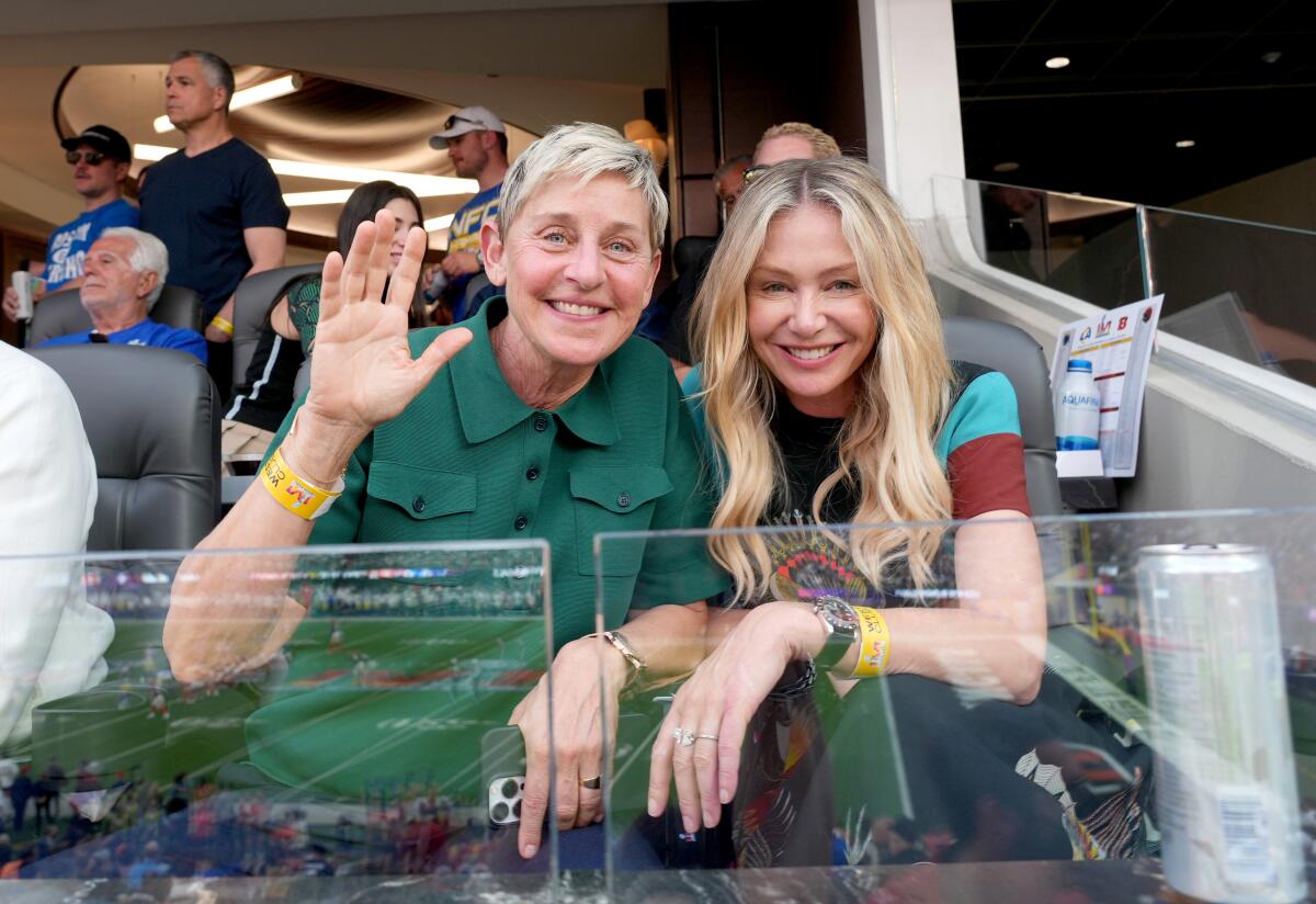 Two women seated at a football game.