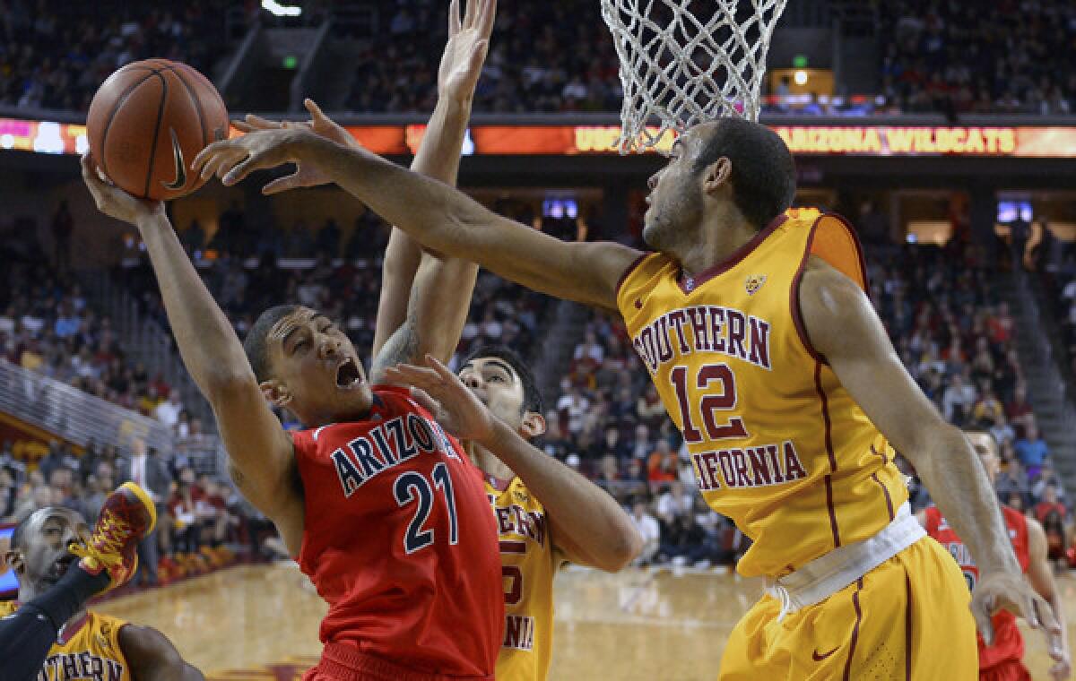 Arizona forward Brandon Ashley, left, puts up a shot in front of guard Julian Jacobs during a Jan. 12 loss. USC looks to pick up its first Pac-12 win against visiting California on Wednesday.