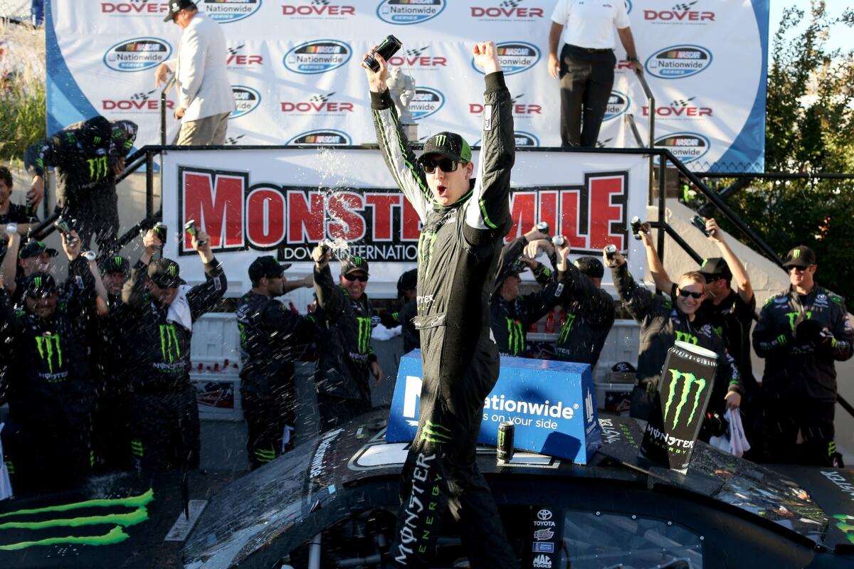 NASCAR driver Kyle Busch celebrates after winning the Nationwide Series Dover 200 on Saturday at Dover International Speedway.