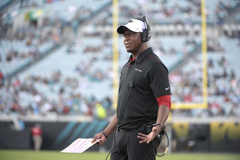 FILE - In this Aug. 19, 2019, file photo, Atlanta Falcons then-assistant head coach/passing game coordinator Raheem Morris watches from the sideline during the first half of a preseason NFL football game against the Jacksonville Jaguars, in Jacksonville, Fla. The Atlanta Falcons have named defensive coordinator Raheem Morris interim head coach after firing Dan Quinn. (AP Photo/Phelan M. Ebenhack, File)
