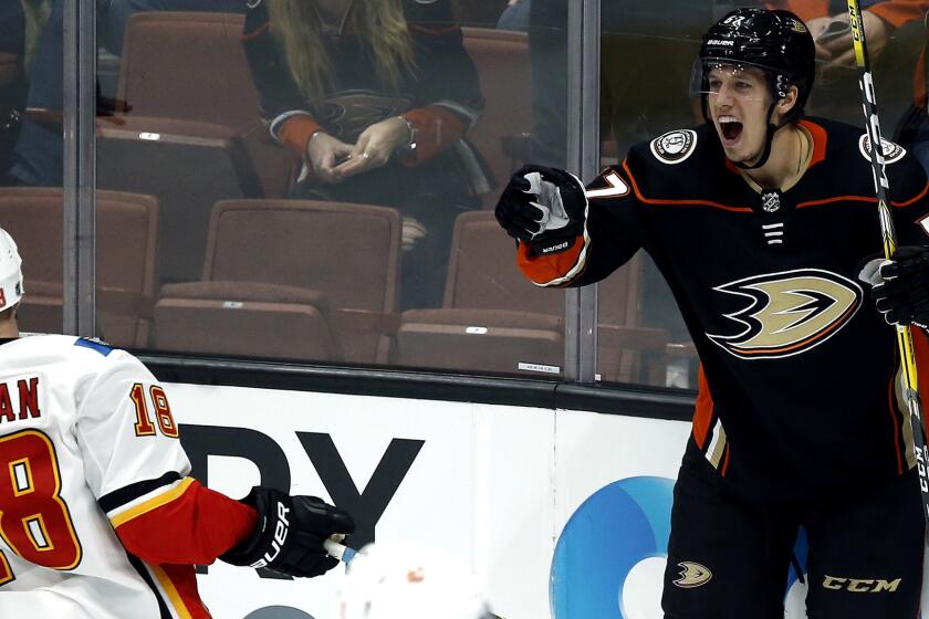 Anaheim Ducks center Rickard Rakell, right, of Sweden, reacts after scoring as Calgary Flames center Matt Stajan skates away during the third period of an NHL hockey game in Anaheim, Calif., Friday, Dec. 29, 2017. The Ducks won 2-1. (AP Photo/Alex Gallardo)