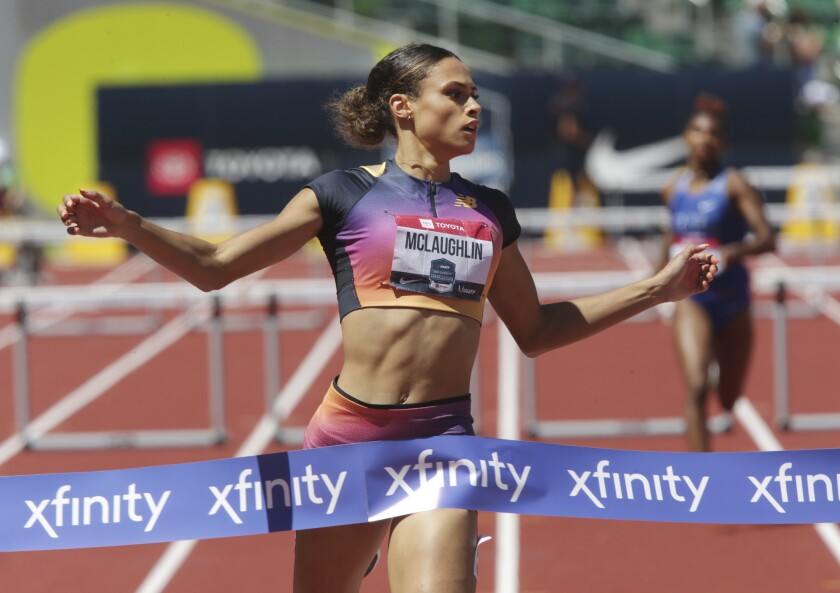 Sydney McLaughlin crosses the finish line to set a new world record in the women's 400 meter hurdles at the U.S. outdoor track and field championships, Saturday, June 25, 2022, in Eugene, Ore. (Chris Pietsch/The Register-Guard via AP)
