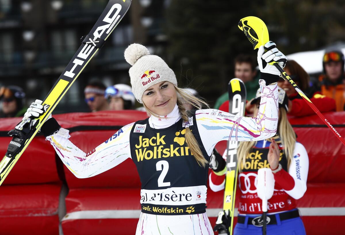 Lindsey Vonn celebrates her second-place finish after completing an alpine ski, women's supercombined, in Val D'Isere, France.