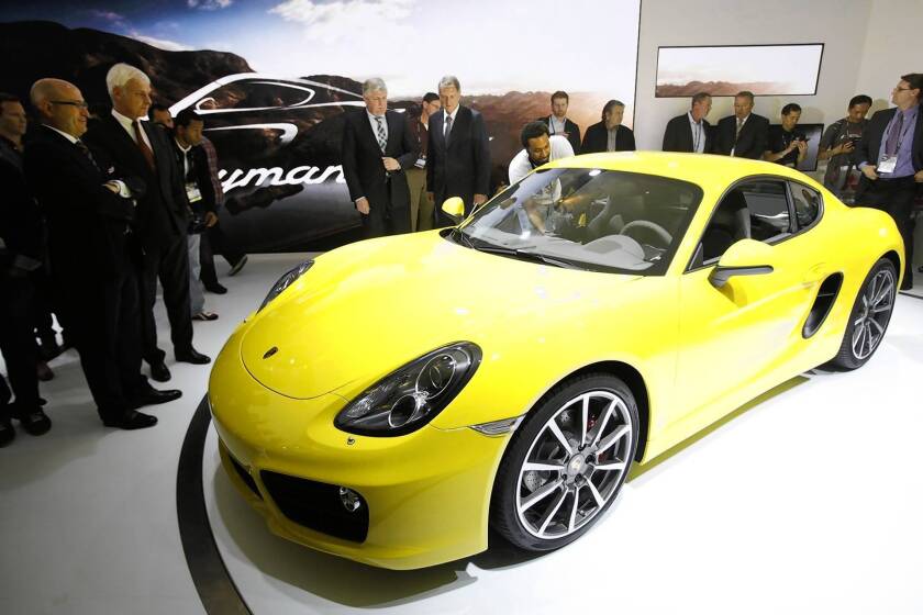 Car lovers are in heaven at the Los Angeles Auto Show, where models such as the Porsche Cayman S are on display.