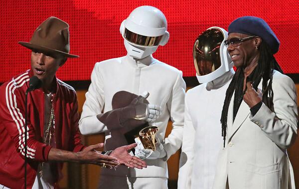 Pharrell Williams, Daft Punk duo, and Nile Rodgers on stage to accept the Grammy Award for record of the year.