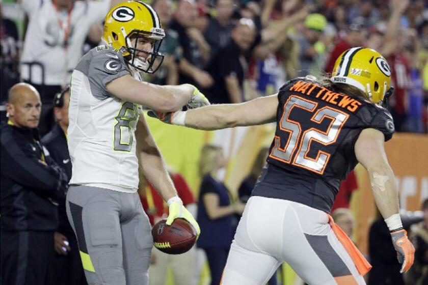 Packers receiver Jordy Nelson is congratulated by Packers linebacker Clay Matthews after scoring a first half touchdown in the Pro Bowl.