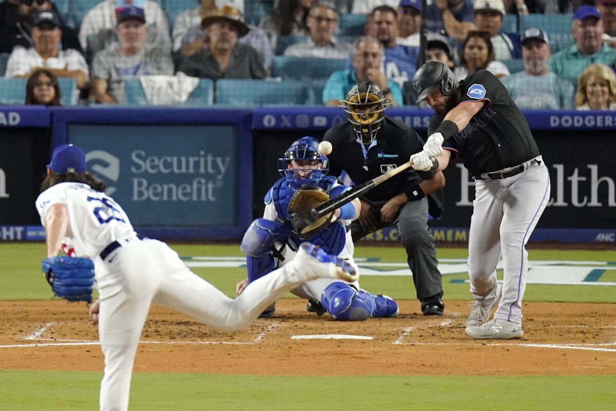 Miami's Jake Burger hits a three-run home run off Dodgers pitcher Tony Gonsolin in the third inning Friday.